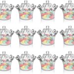 Contenants transparents en forme de couronne remplis de dragées pastel, pour un baptême chic sur le thème royal