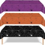 Nappes d'Halloween violette, orange et noire à motif de toiles d'araignée pour habiller la table du goûter