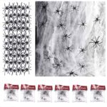 Fausse toile d'araignée blanche extensible et araignées en plastique pour décorer la table du goûter d'Halloween