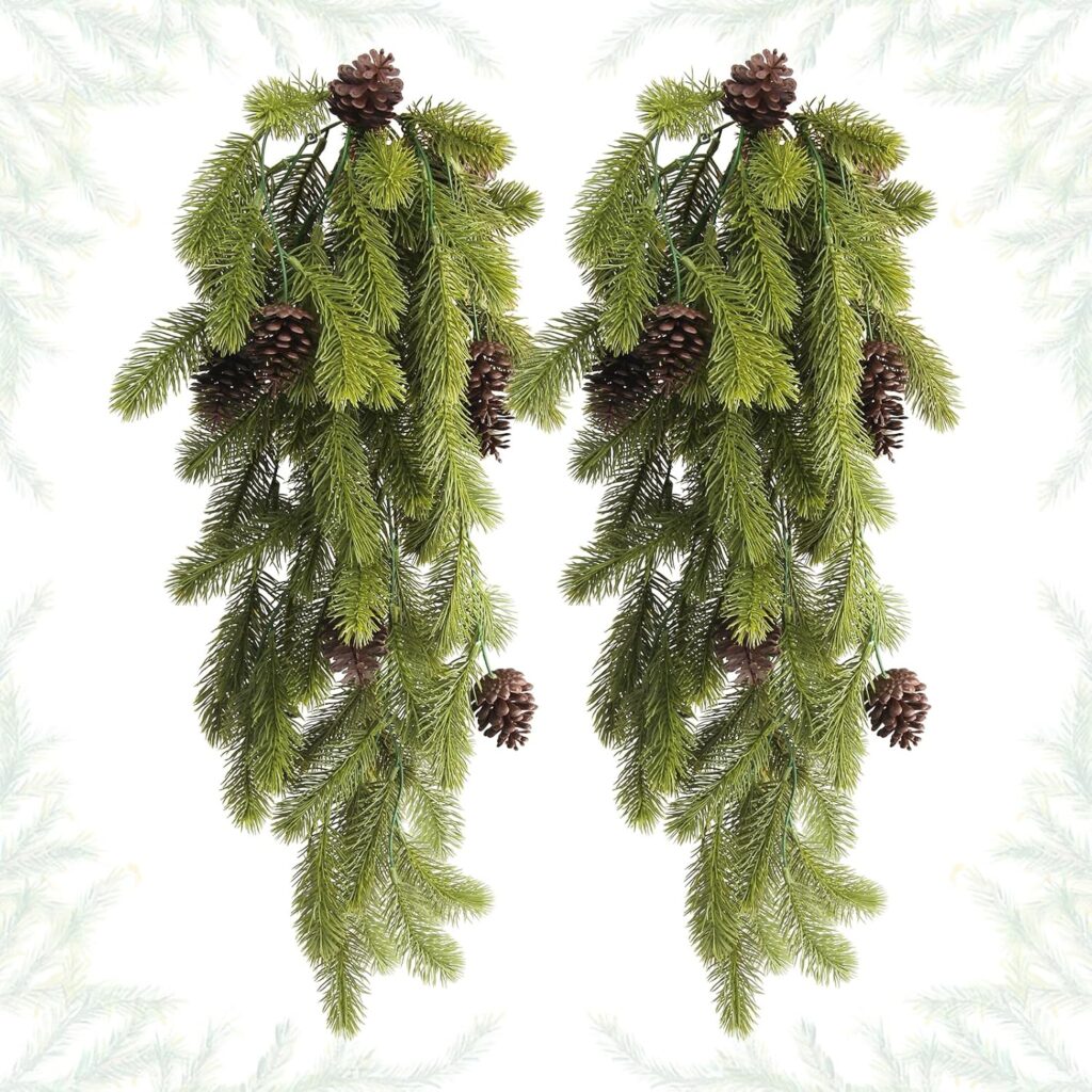 Deux branches de sapin artificielles avec pommes de pin pour suspendre les cadeaux d'un calendrier de l'Avent